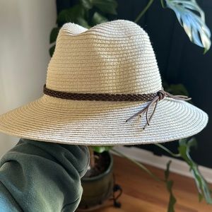 Brand new straw hat and with dark brown braided strap